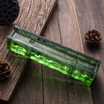 green color glass bricks with holes